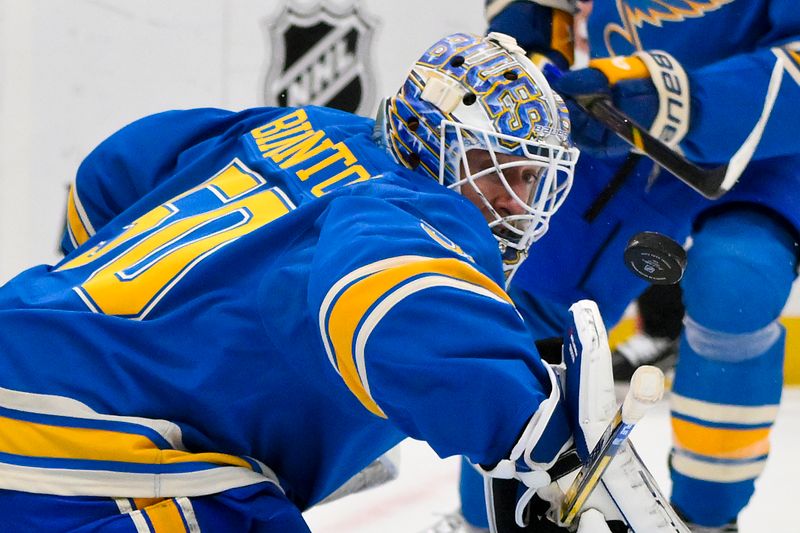 Nov 2, 2024; St. Louis, Missouri, USA;  St. Louis Blues goaltender Jordan Binnington (50) defends the net against the Toronto Maple Leafs during the first period at Enterprise Center. Mandatory Credit: Jeff Curry-Imagn Images