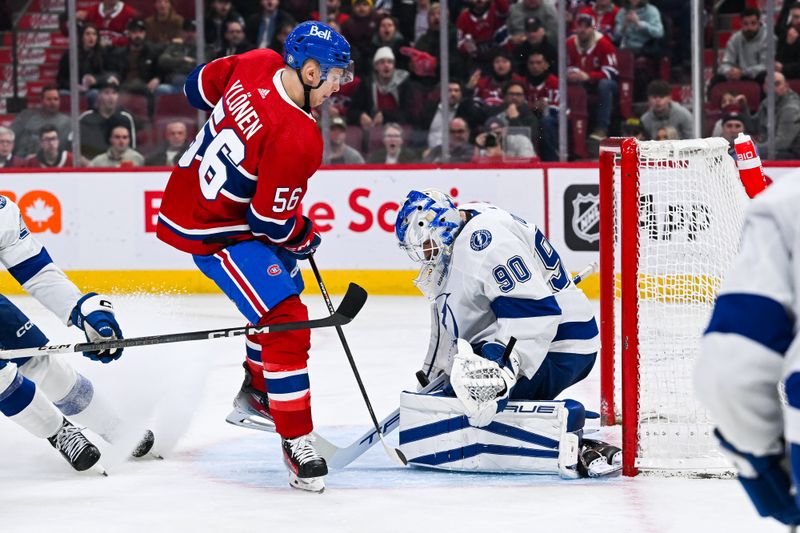 Apr 4, 2024; Montreal, Quebec, CAN; Tampa Bay Lightning goalie Matt Tomkins (90) makes a save against Montreal Canadiens right wing Jesse Ylonen (56) during the third period at Bell Centre. Mandatory Credit: David Kirouac-USA TODAY Sports