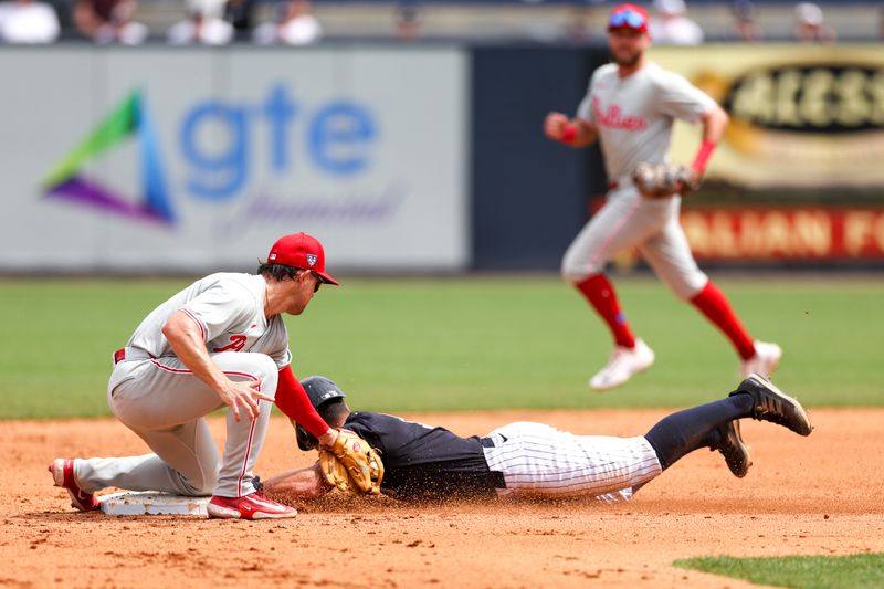 Mar 18, 2024; Tampa, Florida, USA;  New York Yankees shortstop Anthony Volpe (11) is caught stealing second base by Philadelphia Phillies shortstop Scott Kingery (4) in the fifth inning at George M. Steinbrenner Field. Mandatory Credit: Nathan Ray Seebeck-USA TODAY Sports