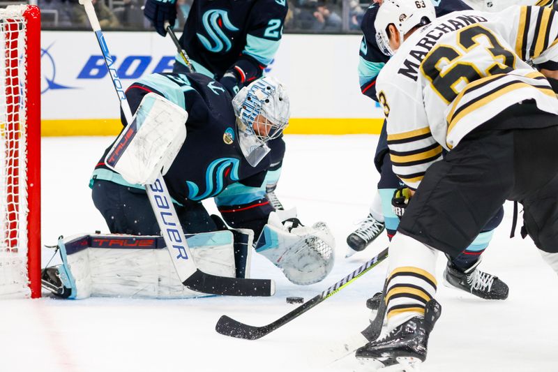 Feb 26, 2024; Seattle, Washington, USA; Seattle Kraken goaltender Philipp Grubauer (31) makes a save against the Boston Bruins during the second period at Climate Pledge Arena. Mandatory Credit: Joe Nicholson-USA TODAY Sports