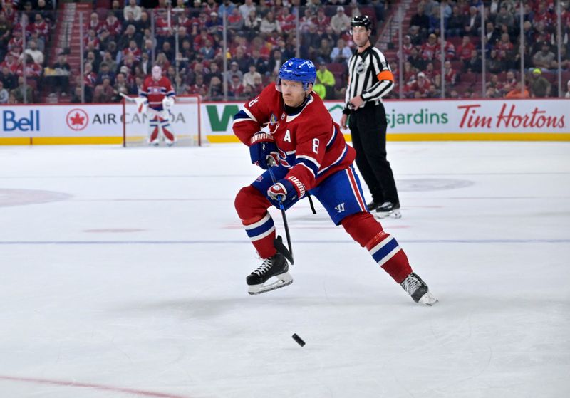 Oct 14, 2025; Montreal, Quebec, CAN; Montreal Canadiens defenseman Mike Matheson (8) plays the puck against the Seattle Kraken during the second period at the Bell Centre. Mandatory Credit: Eric Bolte-Imagn Images