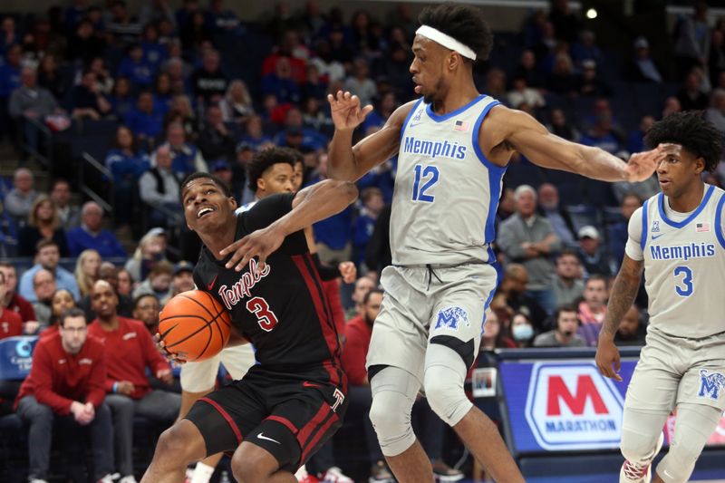 Feb 12, 2023; Memphis, Tennessee, USA; Temple Owls guard Hysier Miller (3) drives to the basket as Memphis Tigers forward DeAndre Williams (12) defends during the second half at FedExForum. Mandatory Credit: Petre Thomas-USA TODAY Sports