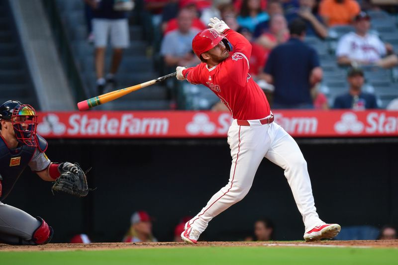 August 16, 2024; Anaheim, California, USA; Los Angeles Angels left fielder Taylor Ward (3) hits a single against the Atlanta Braves during the third inning at Angel Stadium. Mandatory Credit: Gary A. Vasquez-USA TODAY Sports