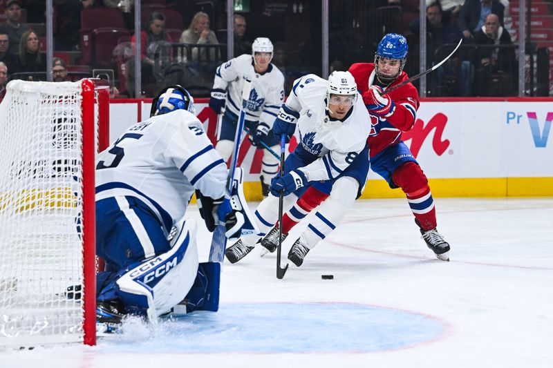 Sep 25, 2025; Montreal, Quebec, CAN; Toronto Maple Leafs forward Dakota Joshua (81) defends the puck against Montreal Canadiens left wing Juraj Slafkovsky (20) during the third period at Bell Centre. Mandatory Credit: David Kirouac-Imagn Images