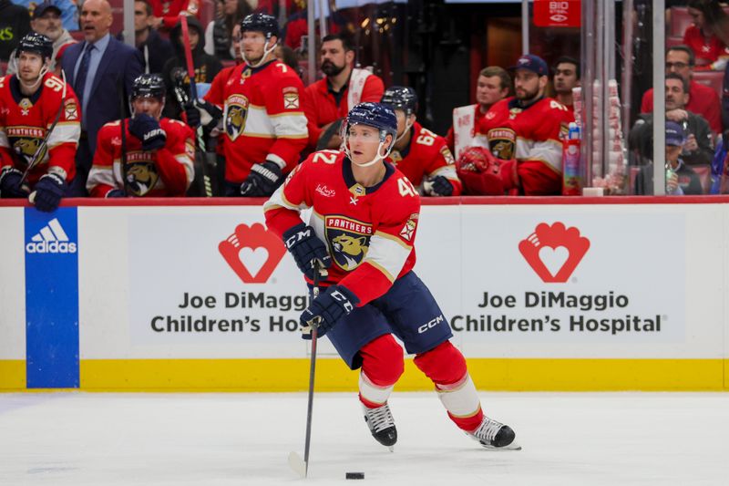 Nov 22, 2023; Sunrise, Florida, USA; Florida Panthers defenseman Gustav Forsling (42) moves the puck against the Boston Bruins during the first period at Amerant Bank Arena. Mandatory Credit: Sam Navarro-USA TODAY Sports