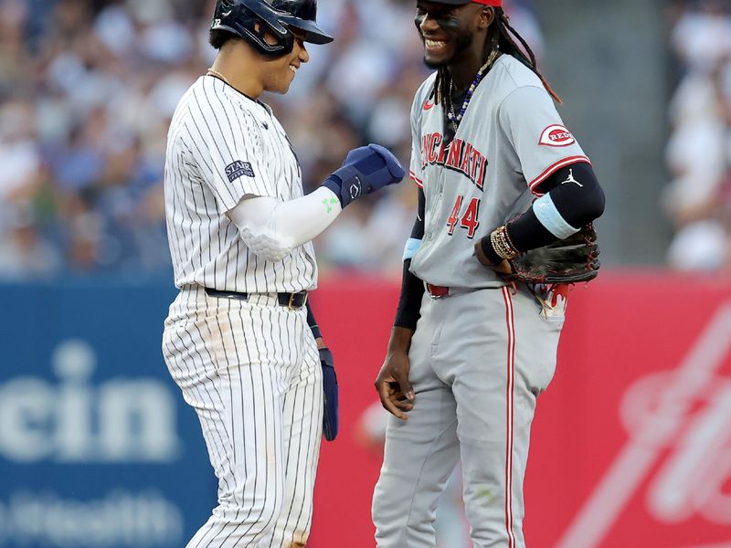 Jul 2, 2024; Bronx, New York, USA; New York Yankees right fielder Juan Soto (22) talks to Cincinnati Reds shortstop Elly De La Cruz (44) at second base during the third inning at Yankee Stadium. Mandatory Credit: Brad Penner-USA TODAY Sports