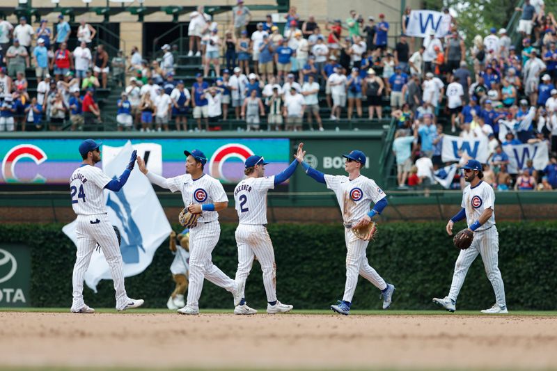 Jun 19, 2024; Chicago, Illinois, USA; Chicago Cubs players celebrate after defeating the San Francisco Giants at Wrigley Field. Mandatory Credit: Kamil Krzaczynski-USA TODAY Sports