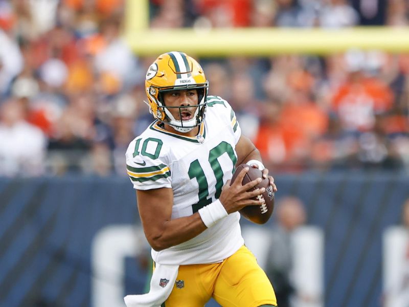 Green Bay Packers quarterback Jordan Love (10) runs with the ball against the Chicago Bears during the second half of an NFL football game, Sunday, Sept. 10, 2023, in Chicago. (AP Photo/Kamil Krzaczynski)