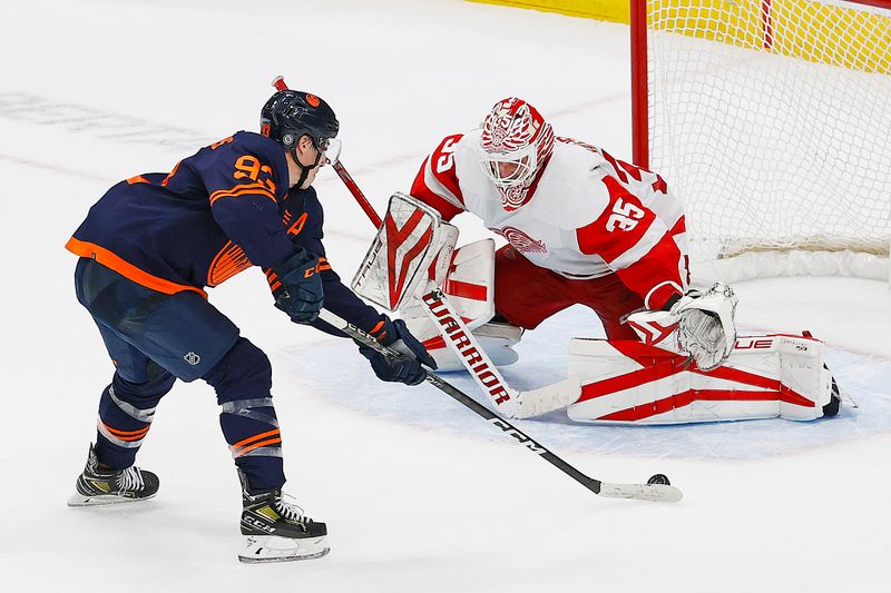 Feb 15, 2023; Edmonton, Alberta, CAN; Detroit Red Wings goaltender Ville Husso (35) makes a save on Edmonton Oilers forward Ryan Nugent-Hopkins (93) during the shoot-out at Rogers Place. Mandatory Credit: Perry Nelson-USA TODAY Sports