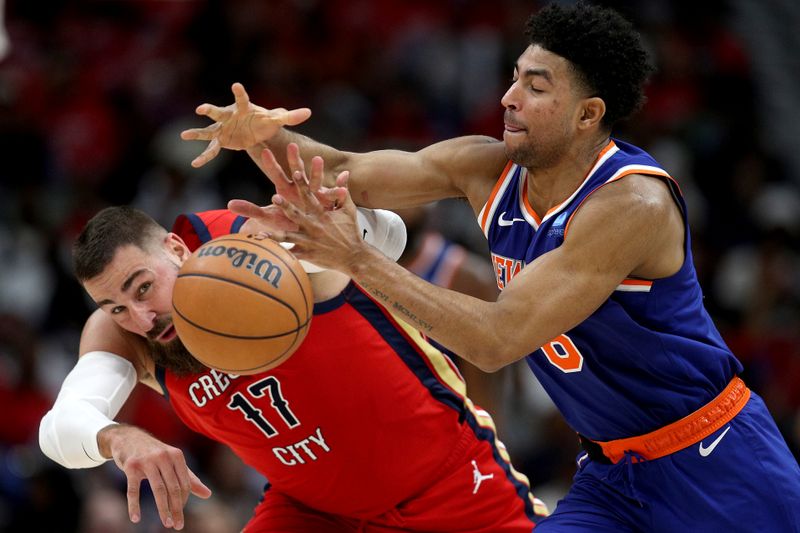 NEW ORLEANS, LOUISIANA - OCTOBER 28: Quentin Grimes #6 of the New York Knicks steals the ball from Jonas Valanciunas #17 of the New Orleans Pelicans during the third quarter of an NBA game at Smoothie King Center on October 28, 2023 in New Orleans, Louisiana. NOTE TO USER: User expressly acknowledges and agrees that, by downloading and or using this photograph, User is consenting to the terms and conditions of the Getty Images License Agreement. (Photo by Sean Gardner/Getty Images)