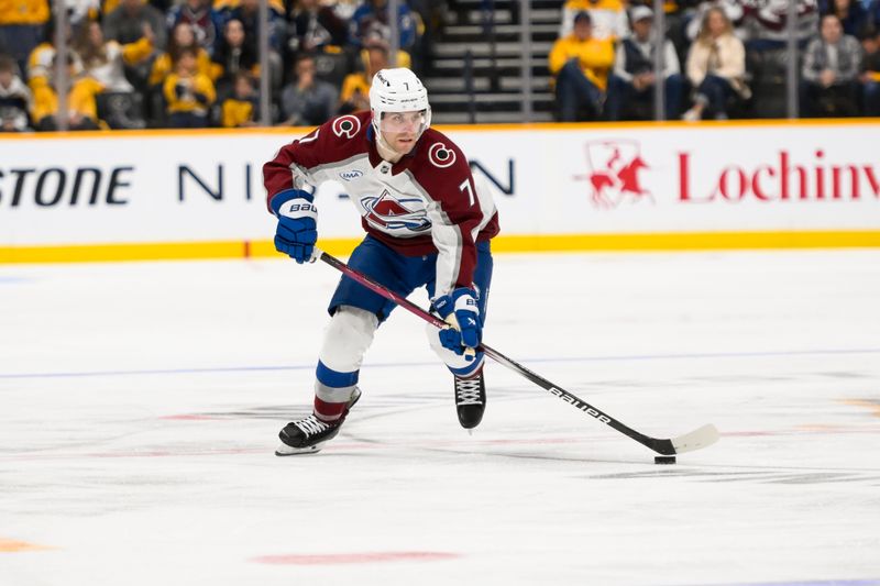 Nov 2, 2024; Nashville, Tennessee, USA;  Colorado Avalanche defenseman Devon Toews (7) skates with the puck against the Nashville Predators during the second period at Bridgestone Arena. Mandatory Credit: Steve Roberts-Imagn Images