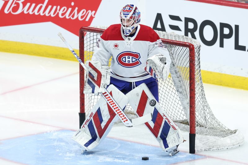 Dec 14, 2024; Winnipeg, Manitoba, CAN; Montreal Canadiens goaltender Sam Montembeault (35) warms up before game against the Winnipeg Jets at Canada Life Centre. Mandatory Credit: James Carey Lauder-Imagn Images