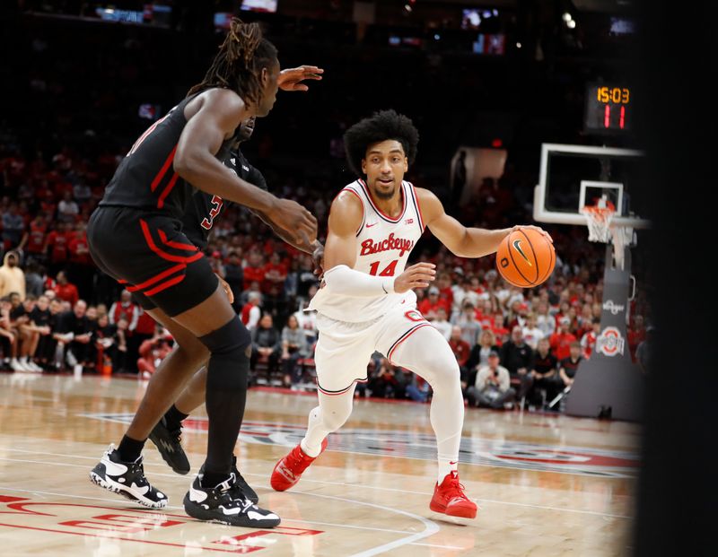 Dec 8, 2022; Columbus, Ohio, USA; Ohio State Buckeyes forward Justice Sueing (14) dribbles the ball as Rutgers Scarlet Knights center Clifford Omoruyi (11) defends during the second half at Value City Arena. Mandatory Credit: Joseph Maiorana-USA TODAY Sports