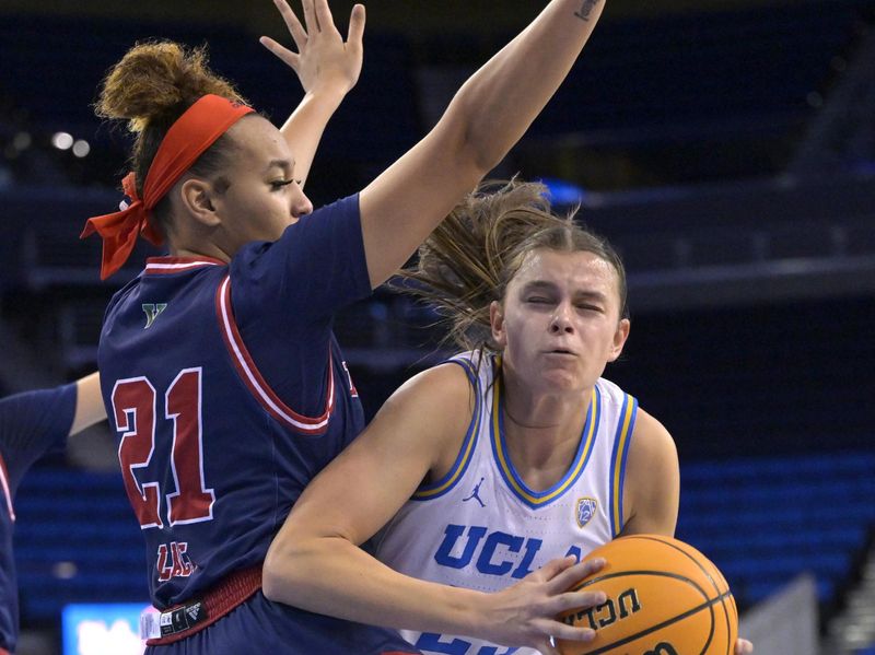 Dec 20, 2022; Los Angeles, California, USA;  UCLA Bruins forward Gabriela Jaquez (23) is defended by Fresno State Bulldogs forward Imani Lacy (21) as she goes for a shot in the first half at Pauley Pavilion presented by Wescom. Mandatory Credit: Jayne Kamin-Oncea-USA TODAY Sports