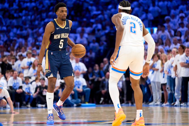 OKLAHOMA CITY, OKLAHOMA - APRIL 21: Herbert Jones #5 of the New Orleans Pelicans brings the ball up court against the Oklahoma City Thunder in game one of the Western Conference First Round Playoffs at the Paycom Center on April 21, 2024 in Oklahoma City, Oklahoma. NOTE TO USER: User expressly acknowledges and agrees that, by downloading and or using this photograph, User is consenting to the terms and conditions of the Getty Images License Agreement.  (Photo by Cooper Neill/Getty Images)