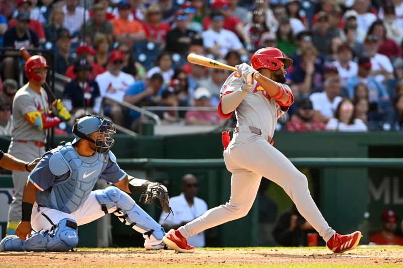 May 10, 2025; Washington, District of Columbia, USA; St. Louis Cardinals center fielder Victor Scott II (11) hits a RBI single against the Washington Nationals during the second inning at Nationals Park. Mandatory Credit: Brad Mills-Imagn Images