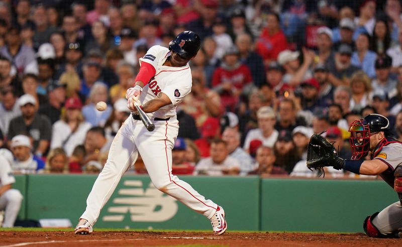 Jun 4, 2024; Boston, Massachusetts, USA; Boston Red Sox third baseman Rafael Devers (11) gets a base hit against the Atlanta Braves in the fourth inning at Fenway Park. Mandatory Credit: David Butler II-USA TODAY Sports