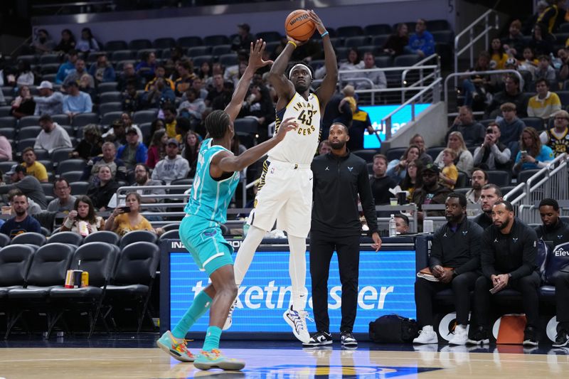 INDIANAPOLIS, INDIANA - OCTOBER 17: Pascal Siakam #43 of the Indiana Pacers attempts a shot while being guarded by Moussa Diabate #14 of the Charlotte Hornets in the third quarter during a preseason game at Gainbridge Fieldhouse on October 17, 2024 in Indianapolis, Indiana. NOTE TO USER: User expressly acknowledges and agrees that, by downloading and or using this photograph, User is consenting to the terms and conditions of the Getty Images License Agreement. (Photo by Dylan Buell/Getty Images)