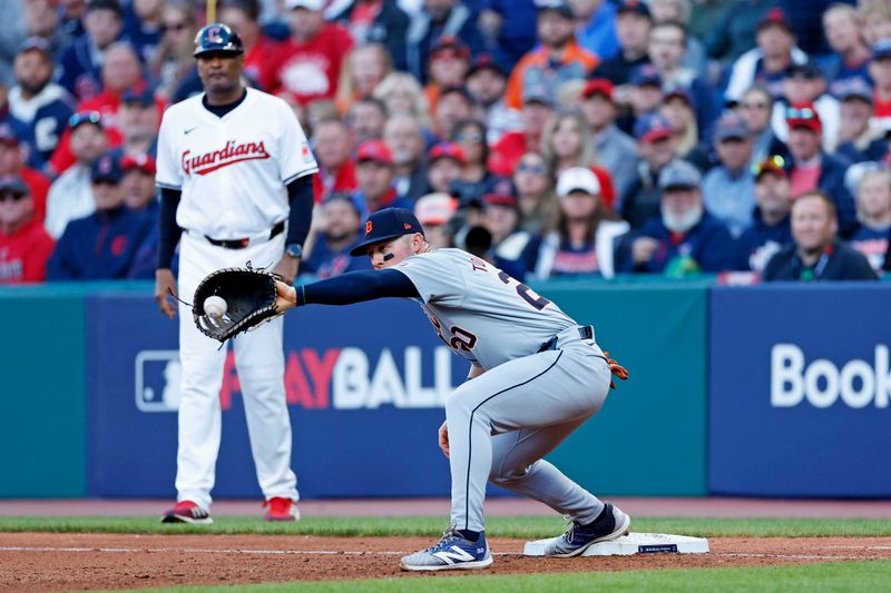 Oct 7, 2024; Cleveland, Ohio, USA; Detroit Tigers first base Spencer Torkelson (20) catches a ball for an out during the seventh inning against the Cleveland Guardians during game two of the ALDS for the 2024 MLB Playoffs at Progressive Field. Mandatory Credit: Scott Galvin-Imagn Images