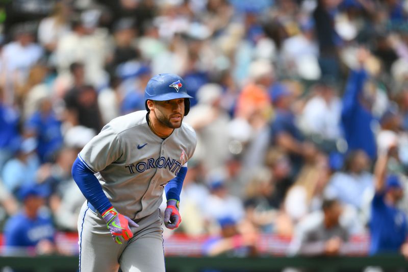 May 11, 2025; Seattle, Washington, USA; Toronto Blue Jays designated hitter George Springer (4) runs the bases after hitting a 3-run home run against the Seattle Mariners during the fifth inning at T-Mobile Park. Mandatory Credit: Steven Bisig-Imagn Images