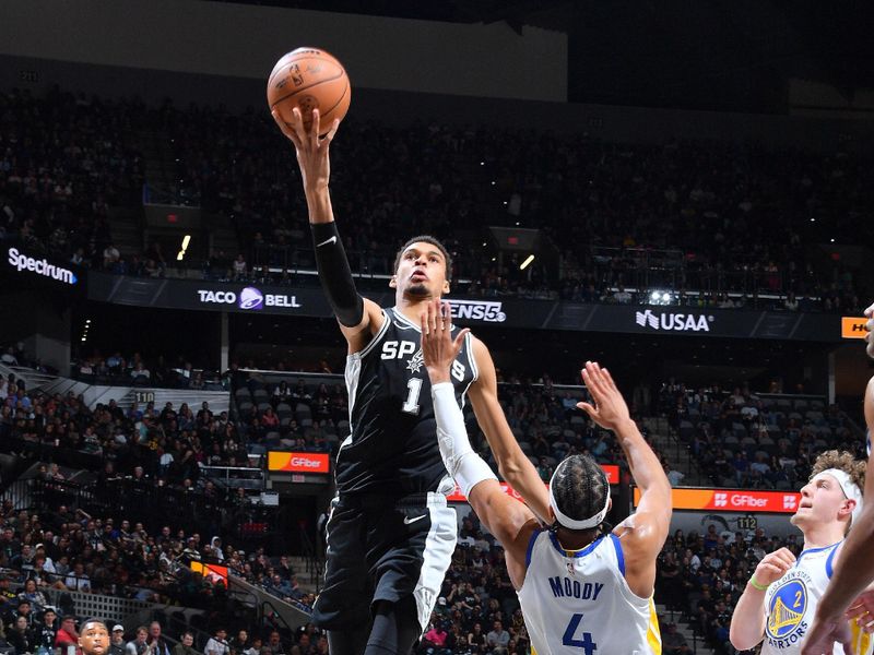 SAN ANTONIO, TX - MARCH 11:  Victor Wembanyama #1 of the San Antonio Spurs drives to the basket during the game against the Golden State Warriors on March 11, 2024 at the Frost Bank Center in San Antonio, Texas. NOTE TO USER: User expressly acknowledges and agrees that, by downloading and or using this photograph, user is consenting to the terms and conditions of the Getty Images License Agreement. Mandatory Copyright Notice: Copyright 2024 NBAE (Photos by Michael Gonzales/NBAE via Getty Images)