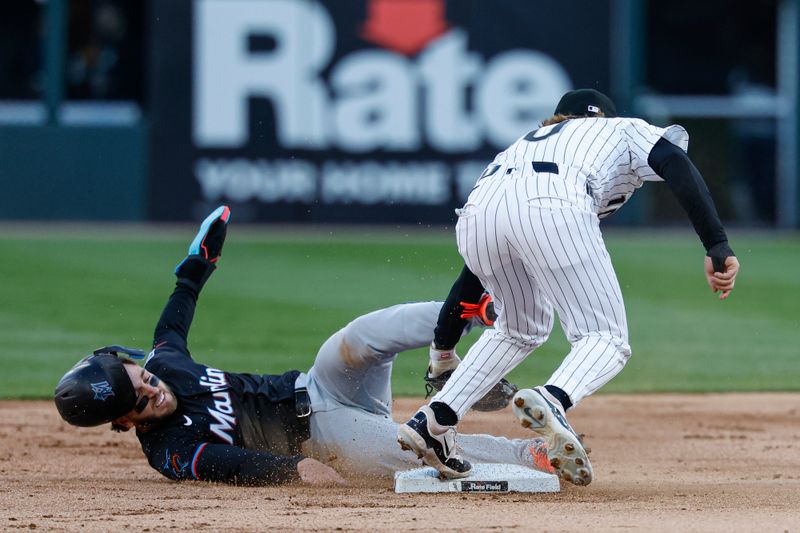 May 10, 2025; Chicago, Illinois, USA; Miami Marlins third baseman Connor Norby (1) steals second base against Chicago White Sox second base Chase Meidroth (10) during the second inning at Rate Field. Mandatory Credit: Kamil Krzaczynski-Imagn Images