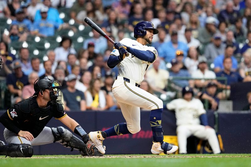Jul 9, 2024; Milwaukee, Wisconsin, USA;  Milwaukee Brewers center fielder Blake Perkins (16) drives in a run during the third inning against the Pittsburgh Pirates at American Family Field. Mandatory Credit: Jeff Hanisch-USA TODAY Sports