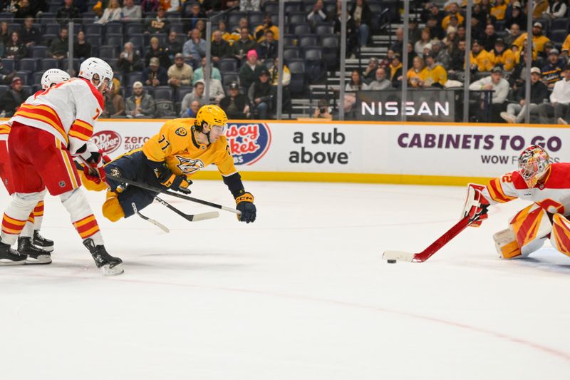 Dec 2, 2025; Nashville, Tennessee, USA;  Calgary Flames defenseman Kevin Bahl (7) trips Nashville Predators right wing Luke Evangelista (77) as he takes a shot on goal during the third period at Bridgestone Arena. Mandatory Credit: Steve Roberts-Imagn Images