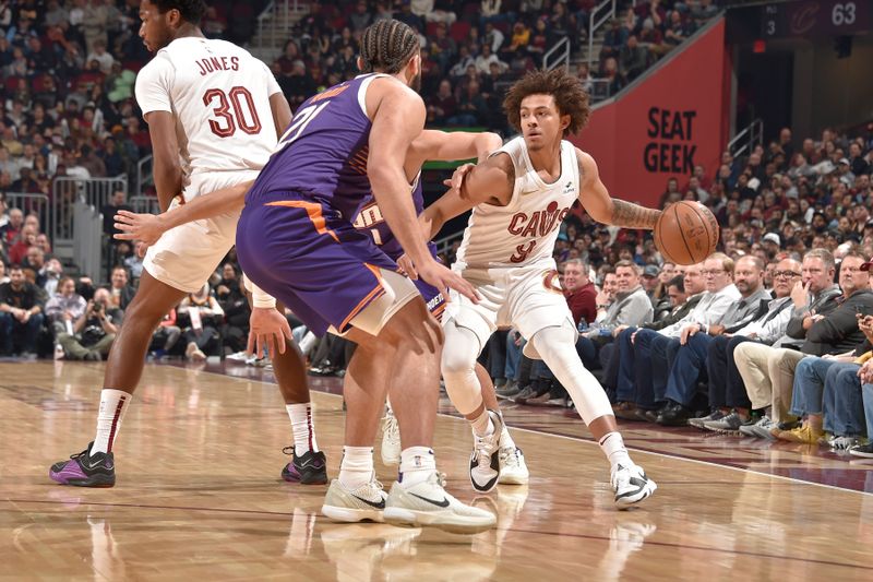 CLEVELAND, OH - MARCH 11: Craig Porter #9 of the Cleveland Cavaliers handles the ball during the game  against the Phoenix Suns on March 11, 2024 at Rocket Mortgage FieldHouse in Cleveland, Ohio. NOTE TO USER: User expressly acknowledges and agrees that, by downloading and/or using this Photograph, user is consenting to the terms and conditions of the Getty Images License Agreement. Mandatory Copyright Notice: Copyright 2024 NBAE (Photo by David Liam Kyle/NBAE via Getty Images)