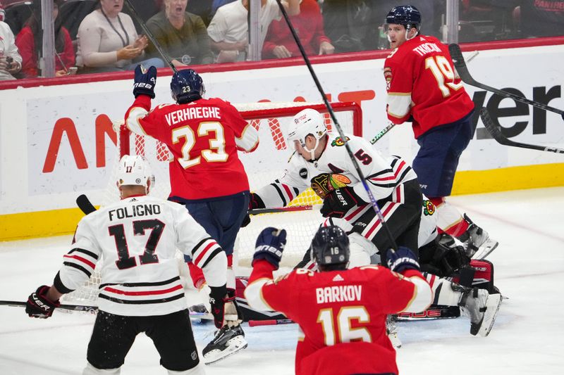 Nov 12, 2023; Sunrise, Florida, USA; Florida Panthers center Carter Verhaeghe (23) scores a goal against the Chicago Blackhawks during the third period at Amerant Bank Arena. Mandatory Credit: Jasen Vinlove-USA TODAY Sports