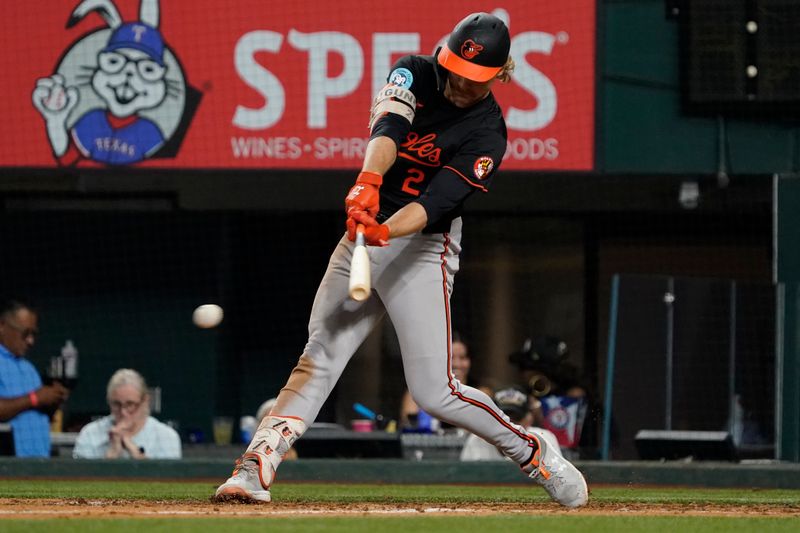 Jul 19, 2024; Arlington, Texas, USA; Baltimore Orioles shortstop Gunnar Henderson (2) hits a single during the seventh inning against the Texas Rangers at Globe Life Field. Mandatory Credit: Raymond Carlin III-USA TODAY Sports