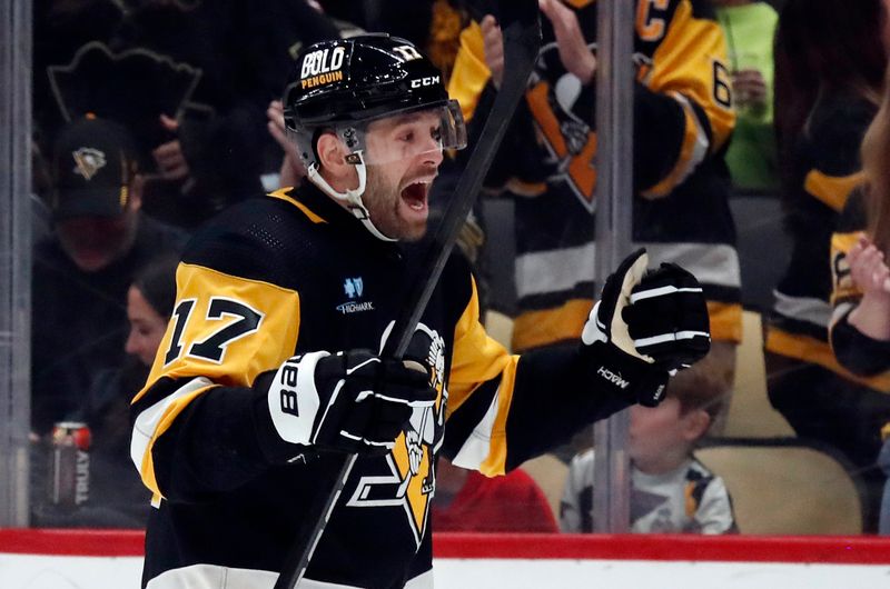 Mar 16, 2024; Pittsburgh, Pennsylvania, USA;  Pittsburgh Penguins right wing Bryan Rust (17) reacts after scoring a goal against the New York Rangers during the first period at PPG Paints Arena. New York won 7-4.  Mandatory Credit: Charles LeClaire-USA TODAY Sports