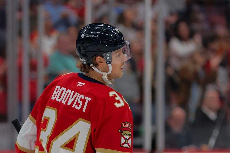 Nov 30, 2024; Sunrise, Florida, USA; Florida Panthers defenseman Adam Boqvist (34) looks on after scoring against the Carolina Hurricanes during the third period at Amerant Bank Arena. Mandatory Credit: Sam Navarro-Imagn Images