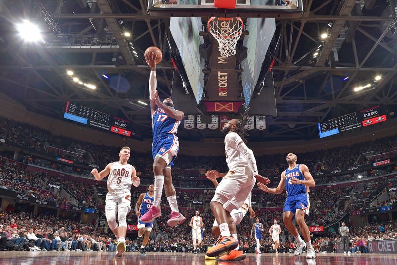 CLEVELAND, OH - MARCH 29: Buddy Heild #17 of the Philadelphia 76ers drives to the basket during the game against the Cleveland Cavaliers on March 29, 2024 at Rocket Mortgage FieldHouse in Cleveland, Ohio. NOTE TO USER: User expressly acknowledges and agrees that, by downloading and/or using this Photograph, user is consenting to the terms and conditions of the Getty Images License Agreement. Mandatory Copyright Notice: Copyright 2024 NBAE (Photo by David Liam Kyle/NBAE via Getty Images)