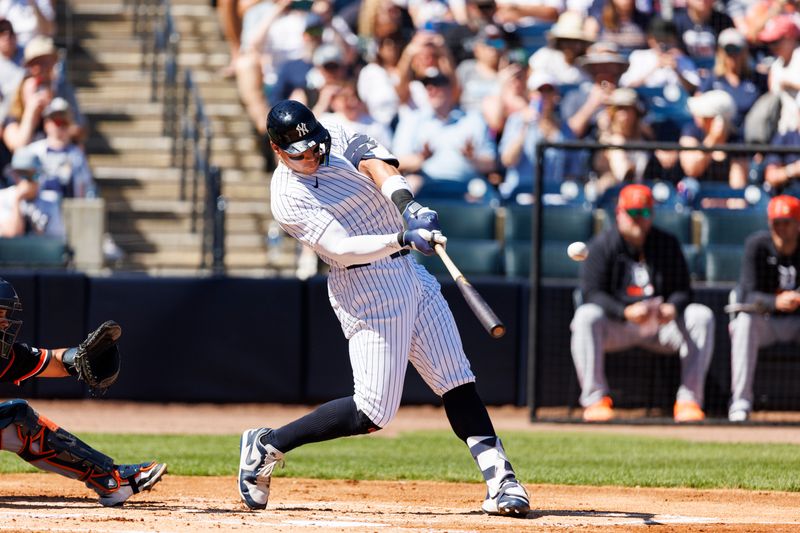 Feb 21, 2026; Tampa, Florida, USA; New York Yankees outfielder Aaron Judge (99)  hits a fly ball against the Detroit  Tigers during the first inning in a Spring Training game at George M. Steinbrenner Field. Mandatory Credit: Morgan Tencza-Imagn Images