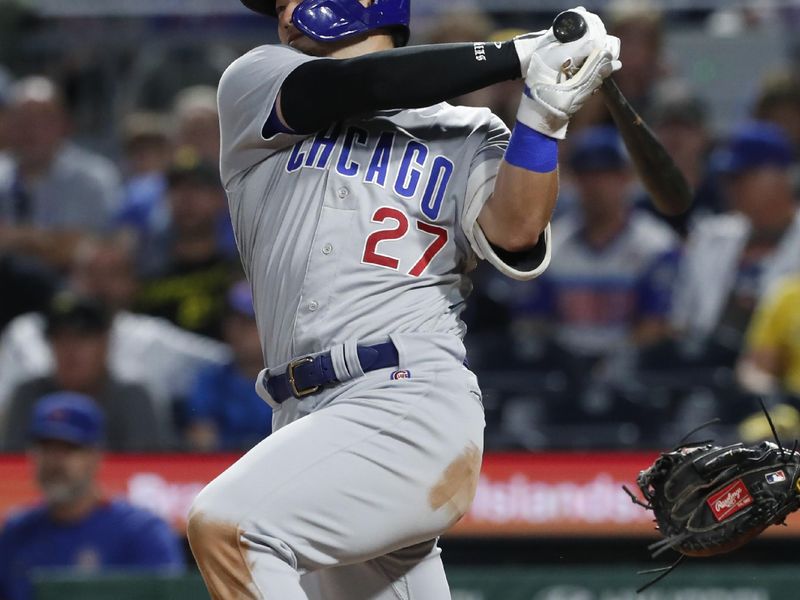 Aug 26, 2023; Pittsburgh, Pennsylvania, USA;  Chicago Cubs right fielder Seiya Suzuki (27) hits a two-run double against the Pittsburgh Pirates during the ninth inning at PNC Park. Mandatory Credit: Charles LeClaire-USA TODAY Sports