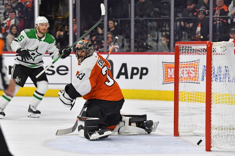 Jan 18, 2024; Philadelphia, Pennsylvania, USA; Philadelphia Flyers goaltender Samuel Ersson (33) looks behind on goal scored by Dallas Stars center Tyler Seguin (91) (not pictured) during the second period at Wells Fargo Center. Mandatory Credit: Eric Hartline-USA TODAY Sports