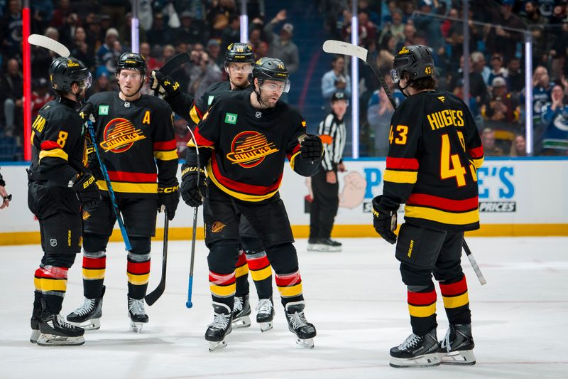Oct 25, 2025; Vancouver, British Columbia, CAN; Vancouver Canucks forward Conor Garland (8) and forward Jake DeBrusk (74) and forward Brock Boeser (6) and forward Elias Pettersson (40) and defenseman Quinn Hughes (43) celebrate Debrusk’s goal against the Montreal Canadiens in the second period at Rogers Arena. Mandatory Credit: Bob Frid-Imagn Images