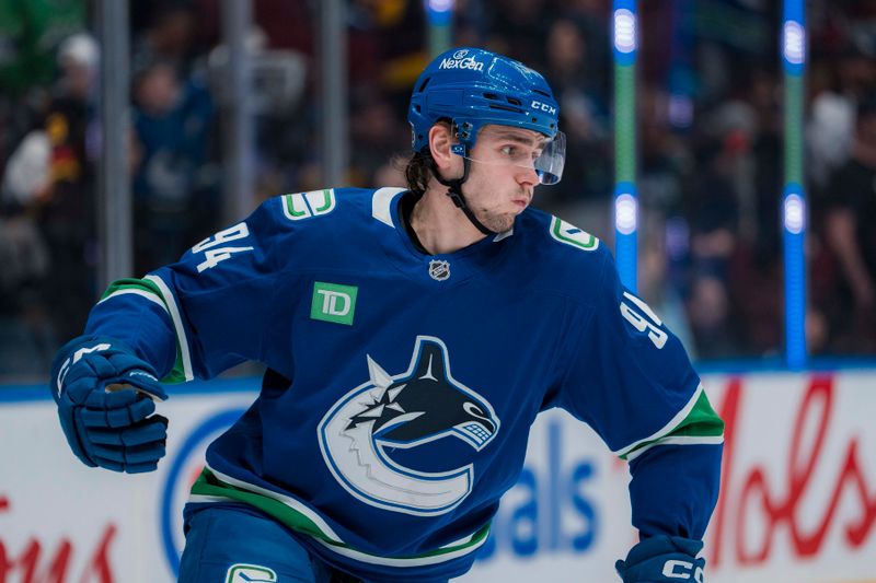 Mar 18, 2025; Vancouver, British Columbia, CAN; Vancouver Canucks forward Linus Karlsson (94) skates  during warm up prior to a game against the Winnipeg Jets at Rogers Arena.  Mandatory Credit: Bob Frid-Imagn Images