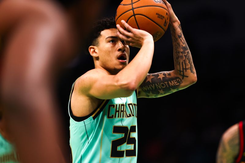 CHARLOTTE, NORTH CAROLINA - NOVEMBER 30: KJ Simpson #25 of the Charlotte Hornets shoots a free throw during the first half of a basketball game against the Atlanta Hawks at Spectrum Center on November 30, 2024 in Charlotte, North Carolina. NOTE TO USER: User expressly acknowledges and agrees that, by downloading and or using this photograph, User is consenting to the terms and conditions of the Getty Images License Agreement. (Photo by David Jensen/Getty Images)