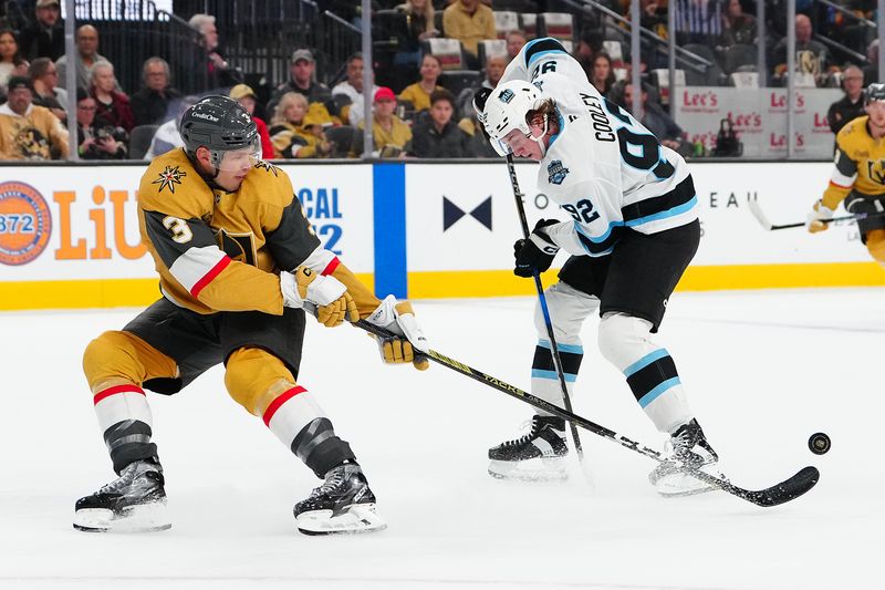 Nov 2, 2024; Las Vegas, Nevada, USA; Vegas Golden Knights defenseman Brayden McNabb (3) tips the puck away from Utah Hockey Club center Logan Cooley (92) during the first period at T-Mobile Arena. Mandatory Credit: Stephen R. Sylvanie-Imagn Images