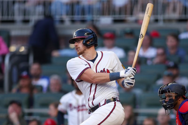 May 12, 2025; Atlanta, Georgia, USA; Atlanta Braves catcher Sean Murphy (12) hits a single against the Washington Nationals in the third inning at Truist Park. Mandatory Credit: Brett Davis-Imagn Images