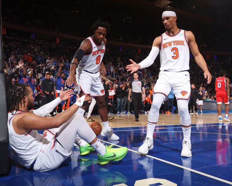 NEW YORK, NY - APRIL 20:  OG Anunoby #8 of the New York Knicks, Josh Hart #3 of the New York Knicks help Jalen Brunson #11 of the New York Knicks up during the game against the Philadelphia 76ers during Round 1 Game 1 of the 2024 NBA Playoffs on April 20, 2024 at Madison Square Garden in New York City, New York.  NOTE TO USER: User expressly acknowledges and agrees that, by downloading and or using this photograph, User is consenting to the terms and conditions of the Getty Images License Agreement. Mandatory Copyright Notice: Copyright 2024 NBAE  (Photo by Nathaniel S. Butler/NBAE via Getty Images)