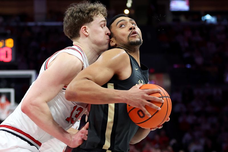 Mar 1, 2026; Columbus, Ohio, USA;  Purdue Boilermakers forward Trey Kaufman-Renn (4) looks to score as Ohio State Buckeyes center Christoph Tilly (13) defends during the first half at Value City Arena. Mandatory Credit: Joseph Maiorana-Imagn Images