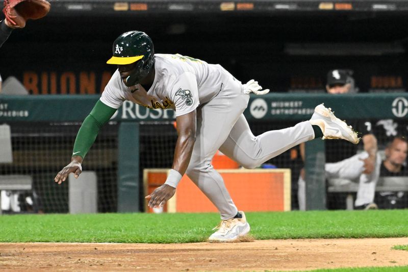 Sep 13, 2024; Chicago, Illinois, USA;  Oakland Athletics outfielder Daz Cameron (28) scores against the Chicago White Sox during the fourth inning at Guaranteed Rate Field. Mandatory Credit: Matt Marton-Imagn Images