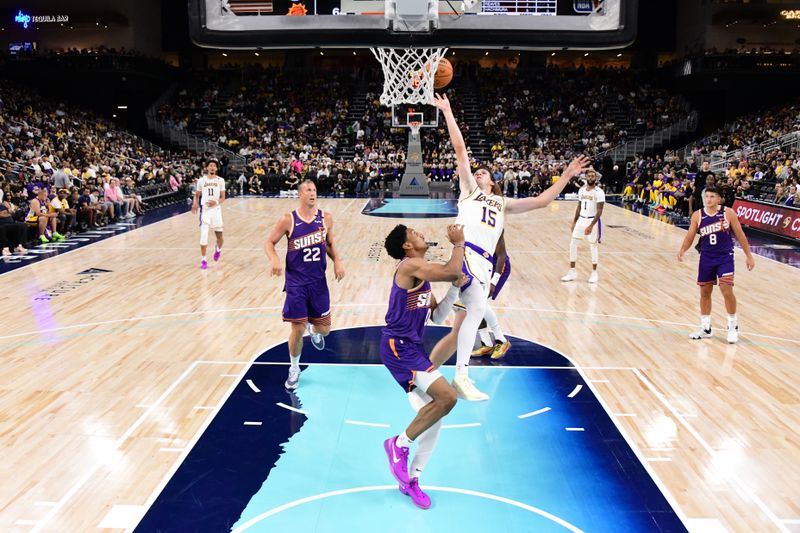 LOS ANGELES, CA - OCTOBER 6: Austin Reaves #15 of the Los Angeles Lakers drives to the basket during the game against the Phoenix Suns on October 6, 2024 at Acrisure Arena in Palm Springs, California. NOTE TO USER: User expressly acknowledges and agrees that, by downloading and/or using this Photograph, user is consenting to the terms and conditions of the Getty Images License Agreement. Mandatory Copyright Notice: Copyright 2024 NBAE (Photo by Adam Pantozzi/NBAE via Getty Images)