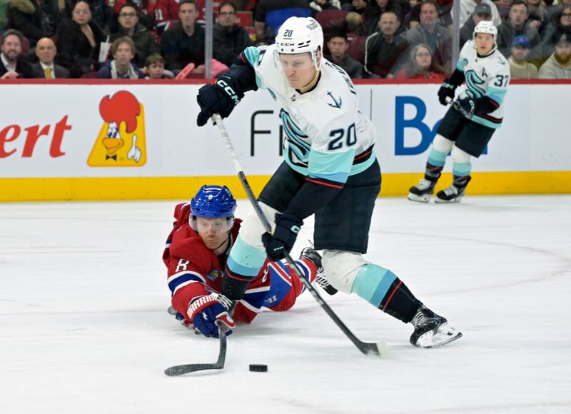 Dec 4, 2023; Montreal, Quebec, CAN; Montreal Canadiens defenseman Mike Matheson (8) pokes the puck away from Seattle Kraken forward Eeli Tolvanen (20) during the first period at the Bell Centre. Mandatory Credit: Eric Bolte-USA TODAY Sports