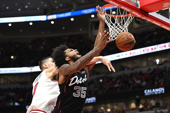 CHICAGO, ILLINOIS - NOVEMBER 12: Nikola Vucevic #9 of the Chicago Bulls blocks the shot of Marvin Bagley III #35 of the Detroit Pistons in the second half at the United Center on November 12, 2023 in Chicago, Illinois.  NOTE TO USER: User expressly acknowledges and agrees that, by downloading and or using this photograph, User is consenting to the terms and conditions of the Getty Images License Agreement.  (Photo by Quinn Harris/Getty Images)