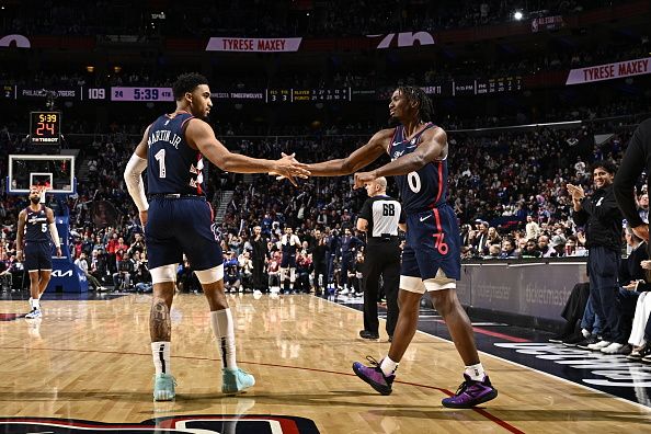 PHILADELPHIA, PA - DECEMBER 20: Kenyon Martin Jr. #1  high fives Tyrese Maxey #0 of the Philadelphia 76ers during the game against the Minnesota Timberwolves on December 20, 2023 at the Wells Fargo Center in Philadelphia, Pennsylvania NOTE TO USER: User expressly acknowledges and agrees that, by downloading and/or using this Photograph, user is consenting to the terms and conditions of the Getty Images License Agreement. Mandatory Copyright Notice: Copyright 2023 NBAE (Photo by David Dow/NBAE via Getty Images)