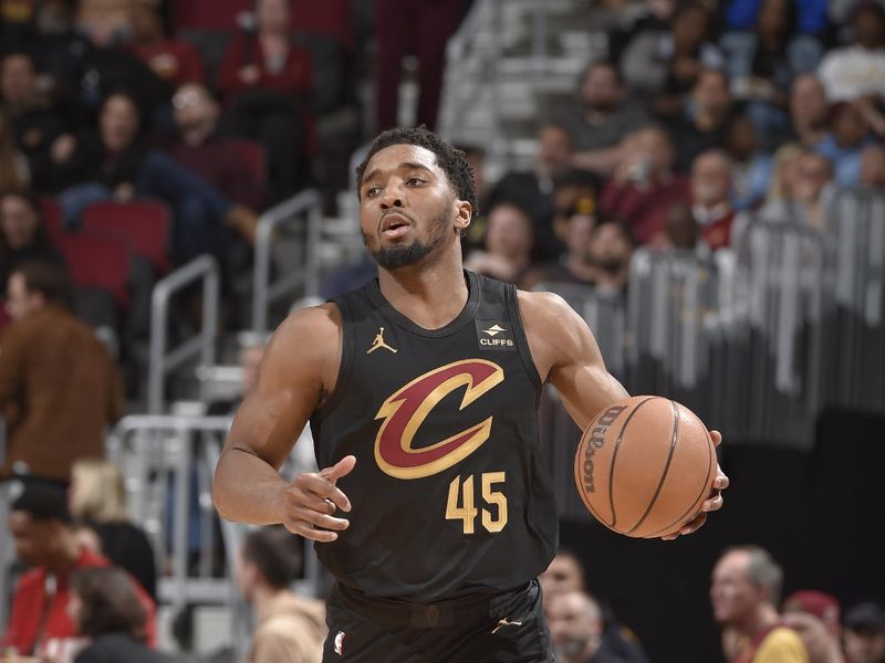 CLEVELAND, OH - APRIL 10: Donovan Mitchell #45 of the Cleveland Cavaliers dribbles the ball during the game against the Memphis Grizzlies on April 10, 2024 at Rocket Mortgage FieldHouse in Cleveland, Ohio. NOTE TO USER: User expressly acknowledges and agrees that, by downloading and/or using this Photograph, user is consenting to the terms and conditions of the Getty Images License Agreement. Mandatory Copyright Notice: Copyright 2024 NBAE (Photo by David Liam Kyle/NBAE via Getty Images)